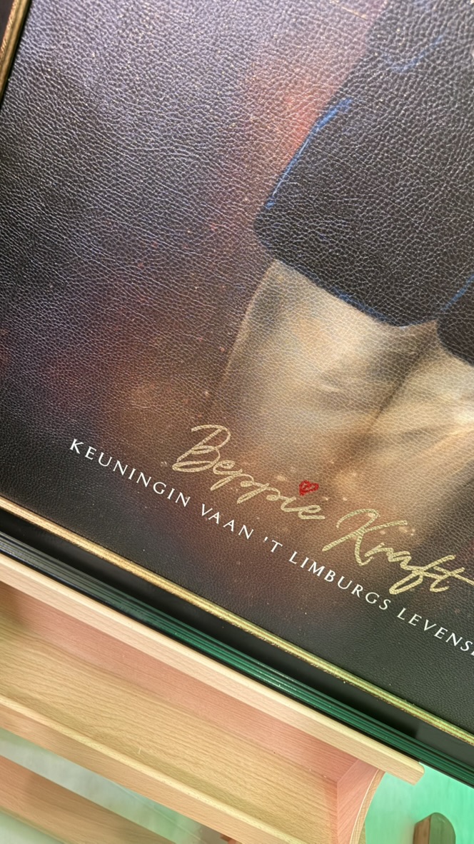 Close-up of the textured surface and gold lettering on the Beppie Kraft portrait