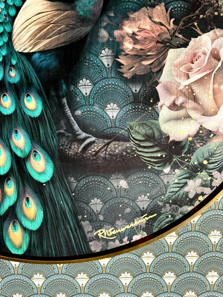 Detail of Pavone showing the artwork’s signature, gold frame and matching wallpaper