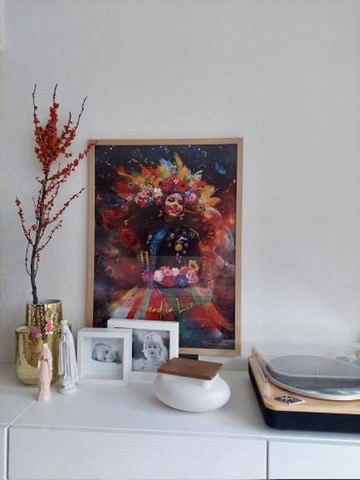 Framed carnival poster displayed in a living room